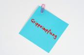 Zettel mit der Aufschrift "Grippeimpfung"
