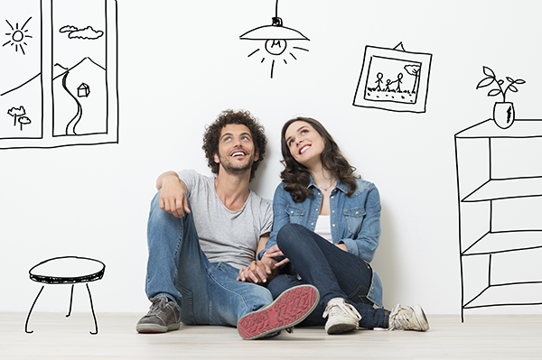 Immobilienkredit absichern: Paar mit Traum von einer eigenen Immobilie